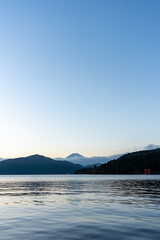 Mt. Fuji and red Torii gate on lake Ashi at Sunset, Hakone, Japan