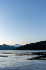 Mt. Fuji and red Torii gate on lake Ashi at Sunset, Hakone, Japan