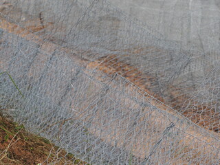 Gabion baskets for stone containment resist erosion and aging.