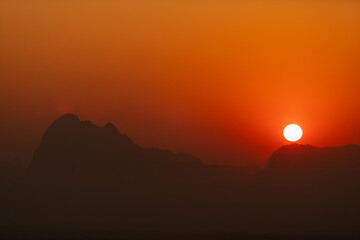Fototapeta premium Sunrise time over the mountain with warm color tone for nature background.. at Phu Kradueng