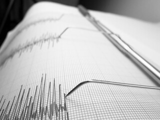 Seismograph and earthquake. A seismograph that records the seismic activity of an earthquake.
