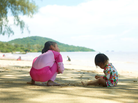 children playing on the beach