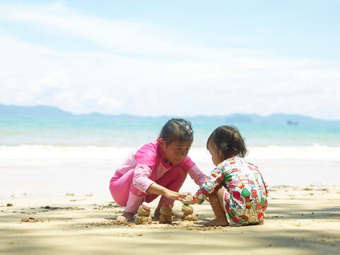 children playing on the beach