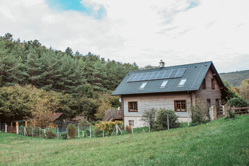 House with solar panels on roof.
