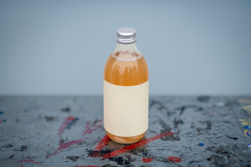 Glass bottle with kombucha. Handmade apple juice in bottle.