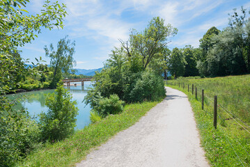idyllic walkway along riverside Mangfall, tourist resort Gmund, upper bavarian landscape