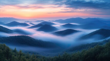 Obraz premium Fog blankets mountain peaks, creating a tranquil dawn atmosphere where nature and sky harmoniously blend in a serene, breathtaking landscape.
