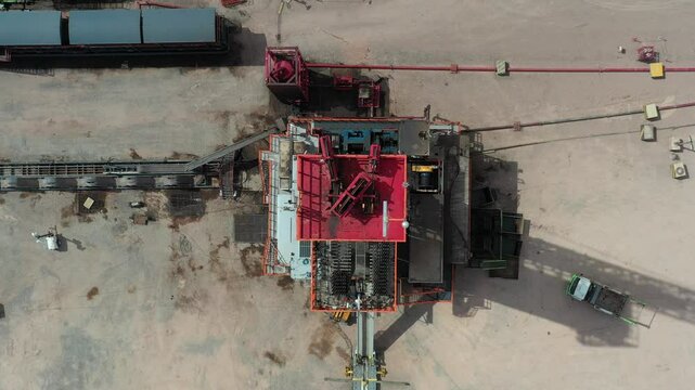 Aerial image captures the top of a fracking drilling rig. The pulleys can be seen turning at high speed to insert the pipes into the ground. Vaca Muerta is the reservoir. Tratayen, Loma Campana