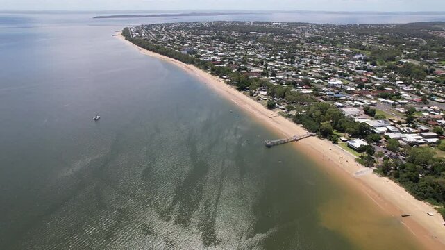 Sweeping views over the jetty at Torquay Beach in Hervey Bay, Australia.