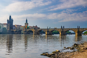 Scenic view of Charles Bridge in Prague, Czech Republic, with its iconic statues and towers...