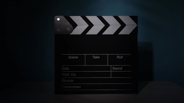clapperboard under cinematic lights, film production setting, director&rsquo;s scene preparation, Hollywood take management, storytelling in motion, movie recording, digital movie industry, media crew