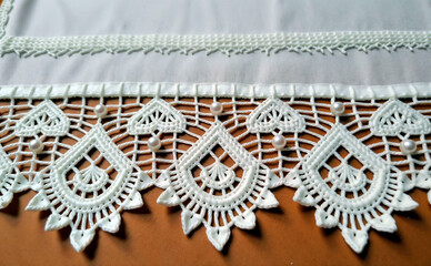 Lace trim with pearls, intricate design, elegant decor, on fabric background