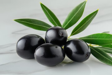 Fresh Black Olives with Green Leaves on a Marble Surface for Culinary and Healthy Living