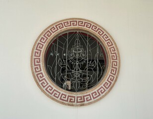 Circular Window with Thai Deity Design in Temple
