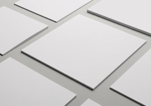  Square Collection Poster Mockup with Top Angle View and Gray Background