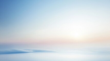 Obraz premium Pastel sunrise over a calm, blurred landscape