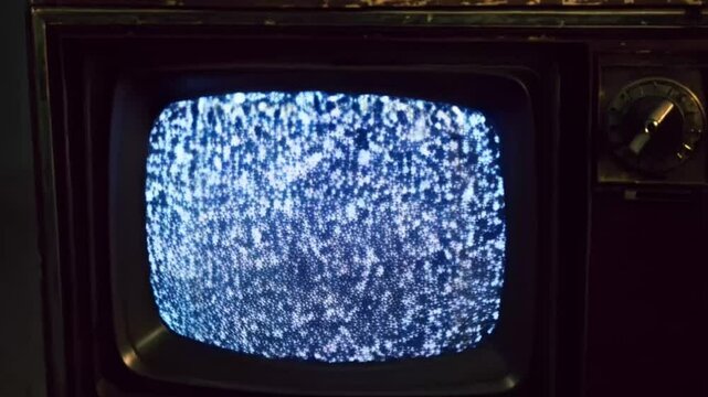 Close up Vintage Television with Static Noise Screen in Room