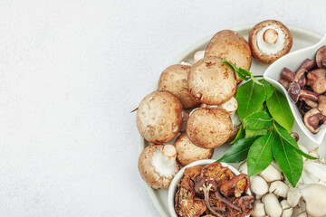 Assortment of various mushrooms - fresh, dried and pickled. Oyster, cremini, porcini and shiitake