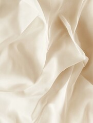 Obraz premium Flowing ivory silk fabric in gentle waves soft texture for elegant backdrop and subtle light