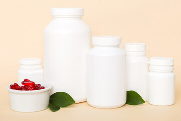 different drugs and health supplement pills with medicine bottle health care and medical top view. Vitamin tablets. Bottle with colored pills on table background. Multivitamins