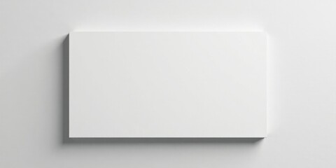 Obraz premium Blank Rectangular Surface on a Light Grey Background, Ideal for Presentations and Mockups