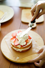 Homemade strawberry shortcake topped with fresh strawberries.