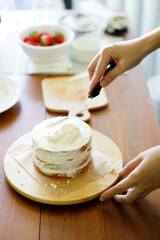 Homemade strawberry shortcake topped with fresh strawberries.