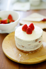 Homemade strawberry shortcake topped with fresh strawberries.