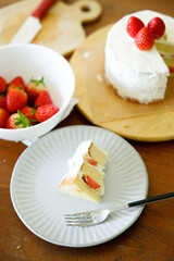 Homemade strawberry shortcake topped with fresh strawberries.
