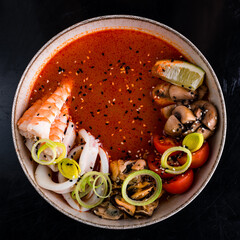 Traditional spicy soup close-up top view, flat lay