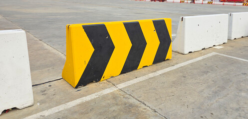 Traffic barrier with black and yellow chevron pattern