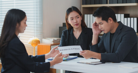 Businesswoman giving resignation letter to hr manager in office meeting