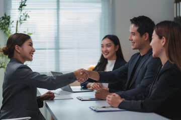 Fototapeta premium Business people shaking hands during a meeting in the office