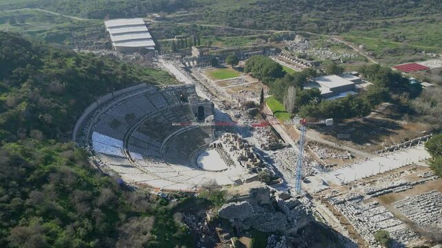 Aerial drone shot of the ancient city of Ephesus, the library of Celsus and the ancient Roman theater on a sunny day. High quality 4k footage