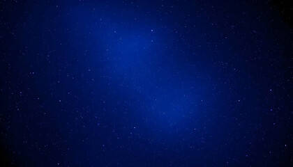 Fototapeta premium Deep Blue Night Sky with Stars Spreading Across the Dark Background