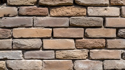 Obraz premium Textured Brick Wall Background in Natural Earthy Tones for Architectural Designs