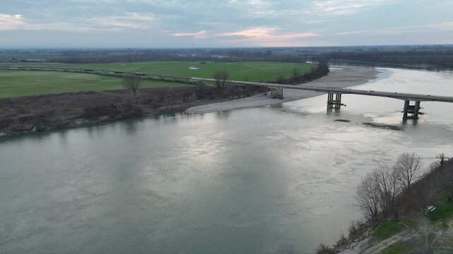 San Daniele Po, Italy March 1st 2025 Isola pescaroli bridge crossing river Po in Cremona, Italy at sunset