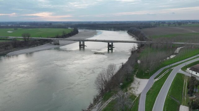 San Daniele Po, Italy March 1st 2025 Isola pescaroli bridge crossing river Po in Cremona, Italy at sunset