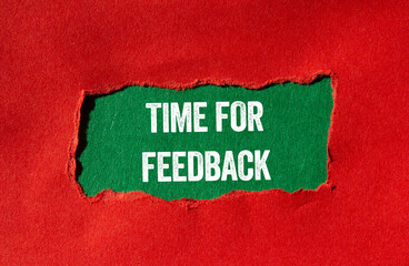 Time for feedback message written on ripped torn red paper on green background. Conceptual time for...