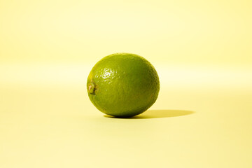 Lime against yellow background