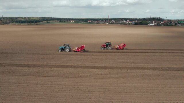 Aerial View of Tractor, Preparing the Potato Field For The New Season