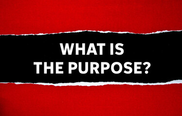 What is the purpose message written on ripped torn red paper on black background. Conceptual what is the purpose symbol. Copy space.