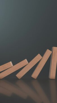 close-up view of falling domino wooden blocks on reflective background, copy space (3d render)