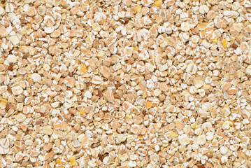 Texture of flat lay of instant wheat flakes.