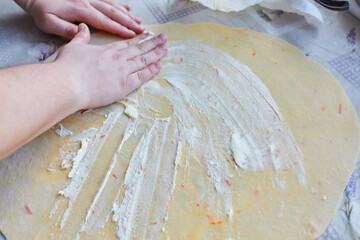 Spreading Cream Cheese on Dough