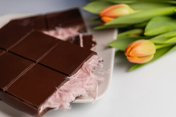 gourmet chocolate bar with pushmania filling (pink angel hair) inside a smooth chocolate shell....