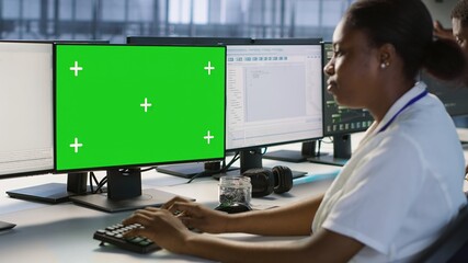 System administrator in server hub ensuring data remains shielded from potential threats using...