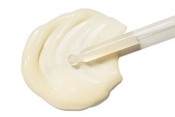 Cosmetic beauty swatch sample. Liquid opaque yellow milky ampoule or serum on white isolated...