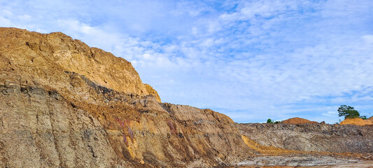 arid land left over from illegal coal mining excavations in Kalimantan, Indonesia	