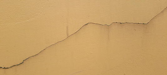 Concrete cement green orange with crack in industrial building	
